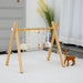 Lilac Wooden Baby Gym | Montessori Infant Play Gym with Hanging Toys - Sweatfully