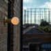 Lochan Wall Light in Brass + Sphere III - Sweatfully
