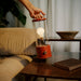 The Muse Portable Lamp in Pomona Red - Sweatfully